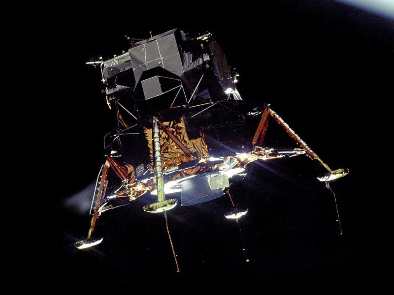 Apollo_11_Lunar_Module_Eagle_in_landing_configuration_in_lunar_orbit_from_the_Command_and_Service_Module_Columbia